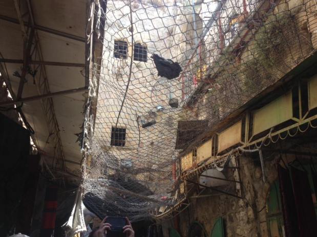 Items thrown by the Israeli settlers on the people in the market street and the makeshift mesh put up by the Palestinians to defend themselves. Hebron 